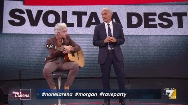 Giletti: "Ci vorrebbe Battiato" e Morgan canta per i migranti.