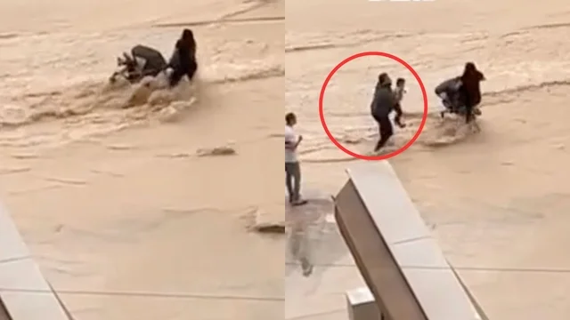 Maltempo, attraversa la strada allagata con il passeggino e il bimbo cade in acqua: i momenti di terrore