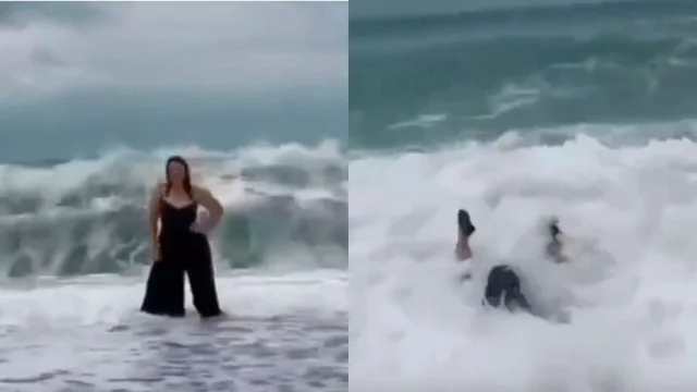 Vuole farsi fotografare sulla riva non vede arrivare un’onda gigante alle sue spalle: il video è virale