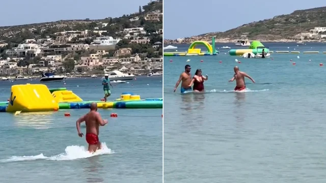 "C'è uno squalo!" e i bagnanti scappano in spiaggia. Ma è un tonno...