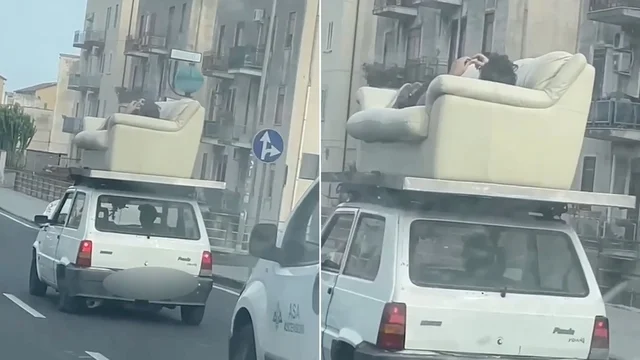 Catania, uomo sdraiato sul divano sul tetto dell'auto per le vie della città: il video della follia