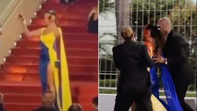 Cannes, donna con un vestito con i colori della bandiera ucraina si cosparge con di sangue finto